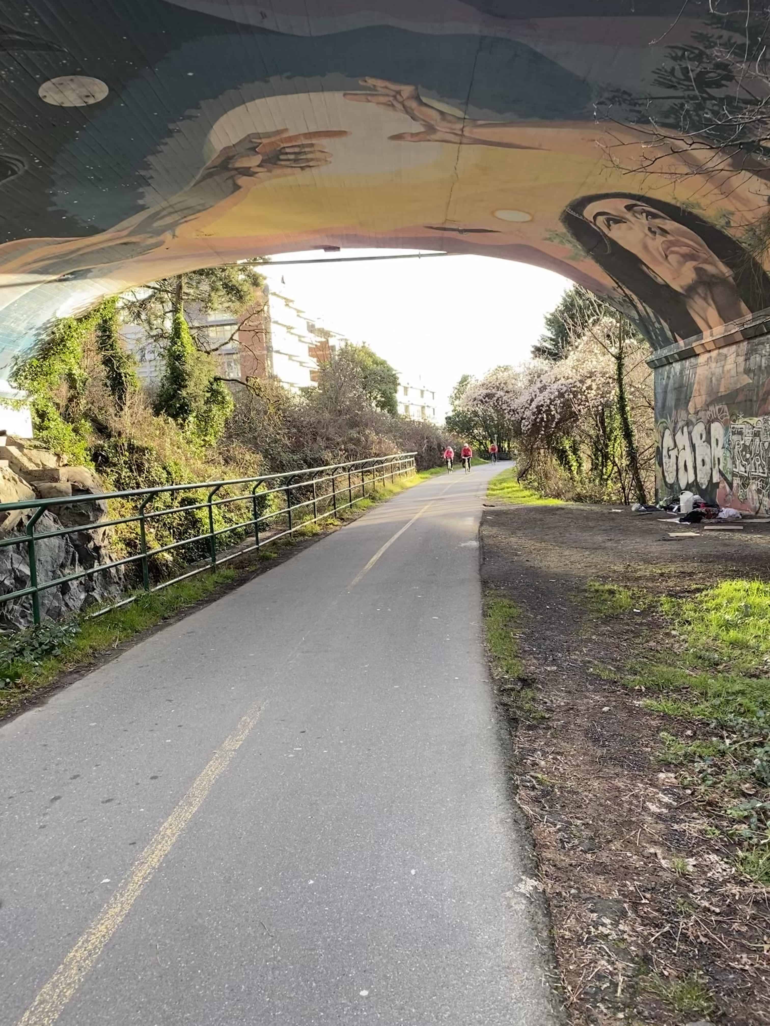 Artwork under bridge was much more extensive before it was touched with graffiti. What remains is quite beautiful.