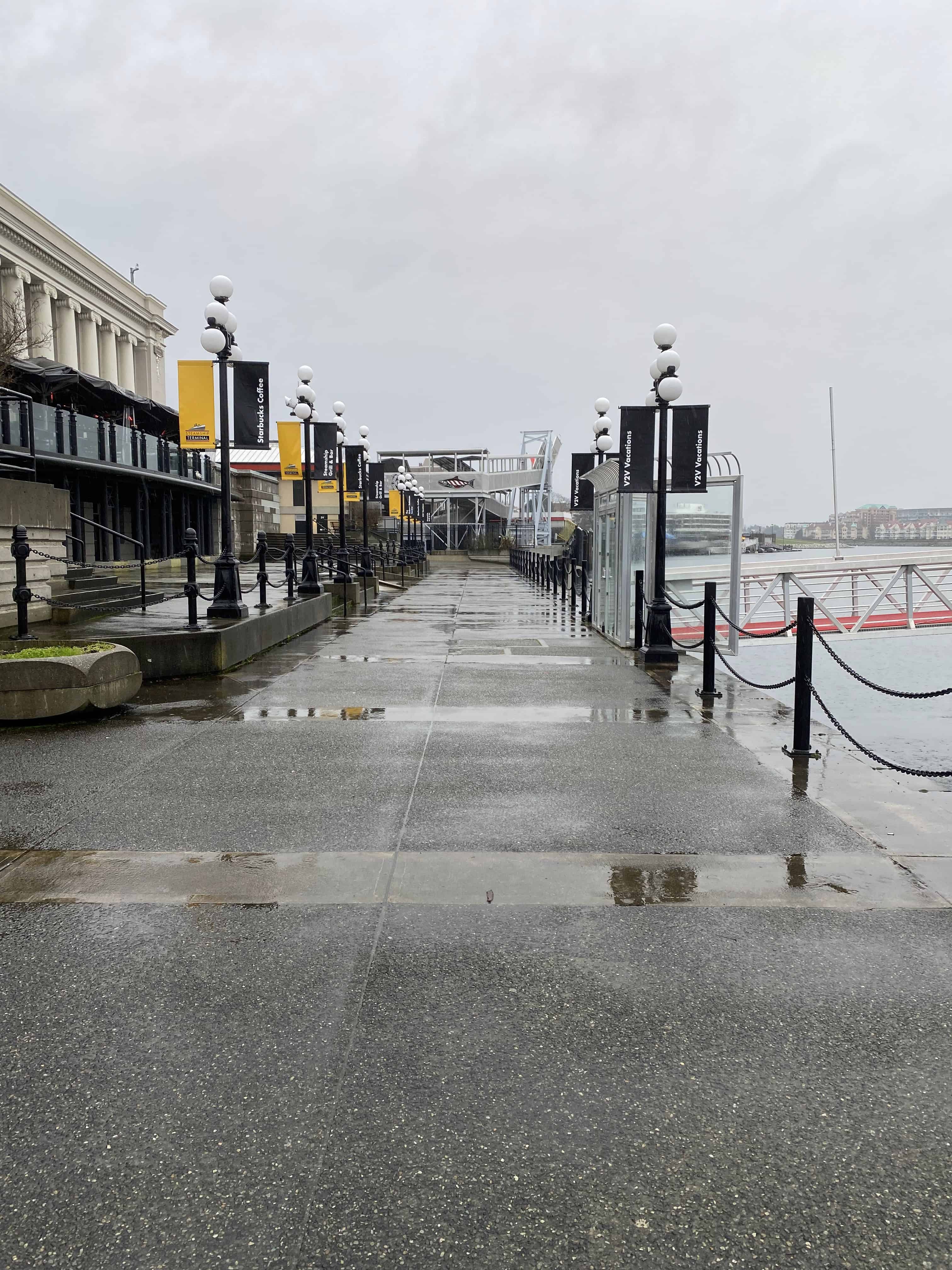 Victoria Inner Harbour walkway with the Steamship Grill and Bar on the left, ferry ramp on the right