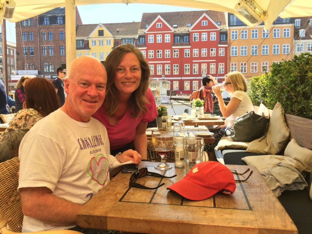Gail and Paul relaxing for lunch at Nyhavn -Things to do when only 3 Days in Copenhagen Denmark