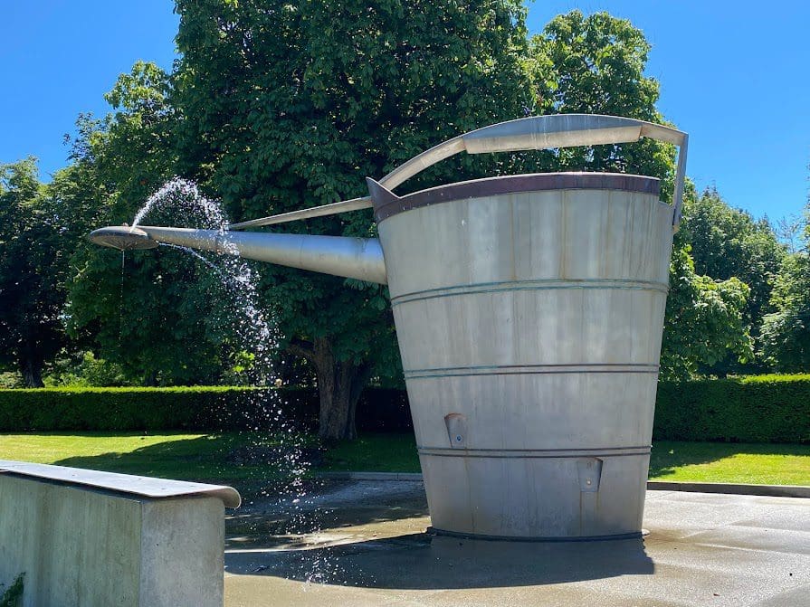 Large "Watering Can" at the spray park, spouting water in this picture.