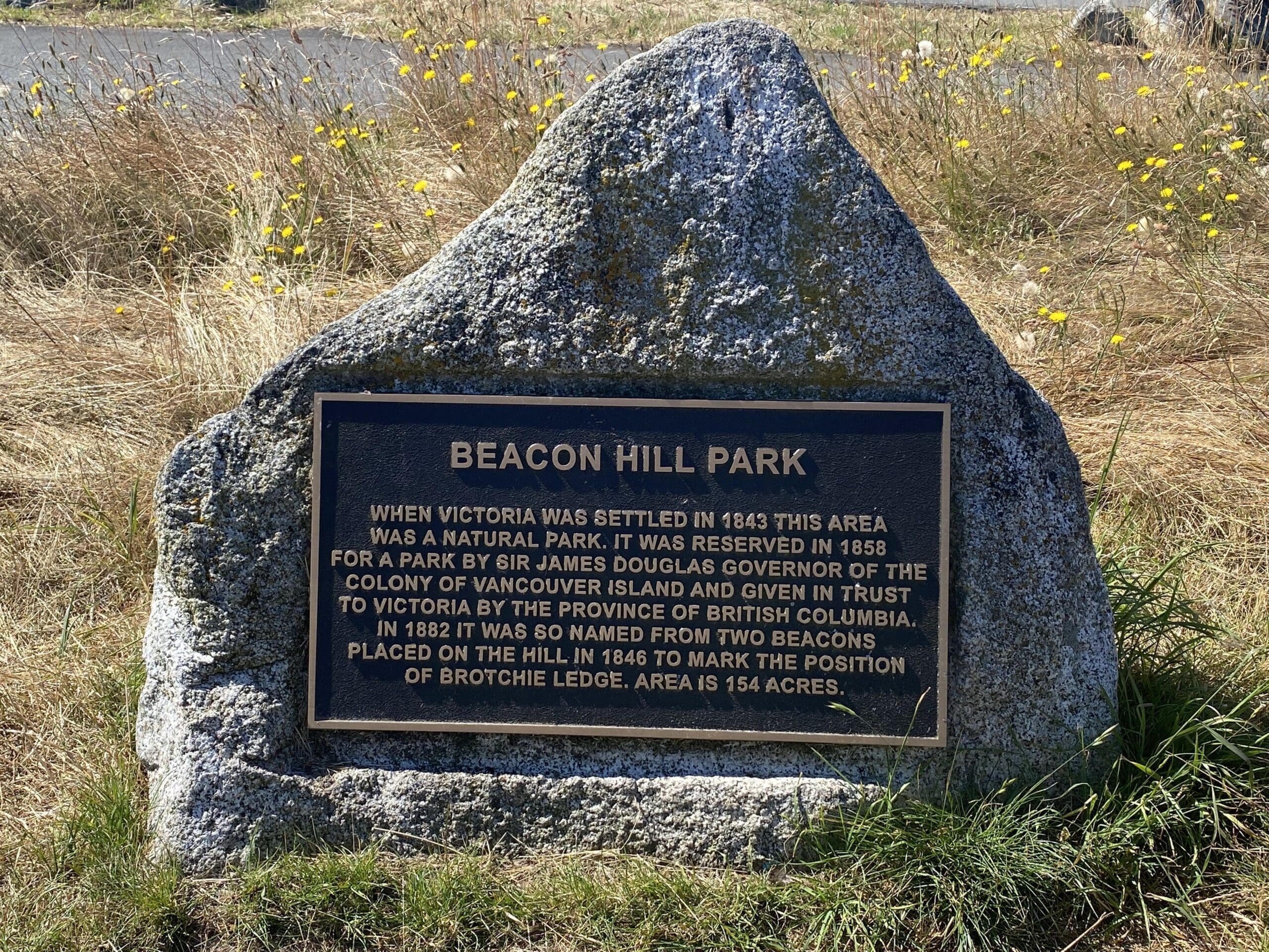 Beacon Hill Park monument showing history of the park, atop Beacon Hill