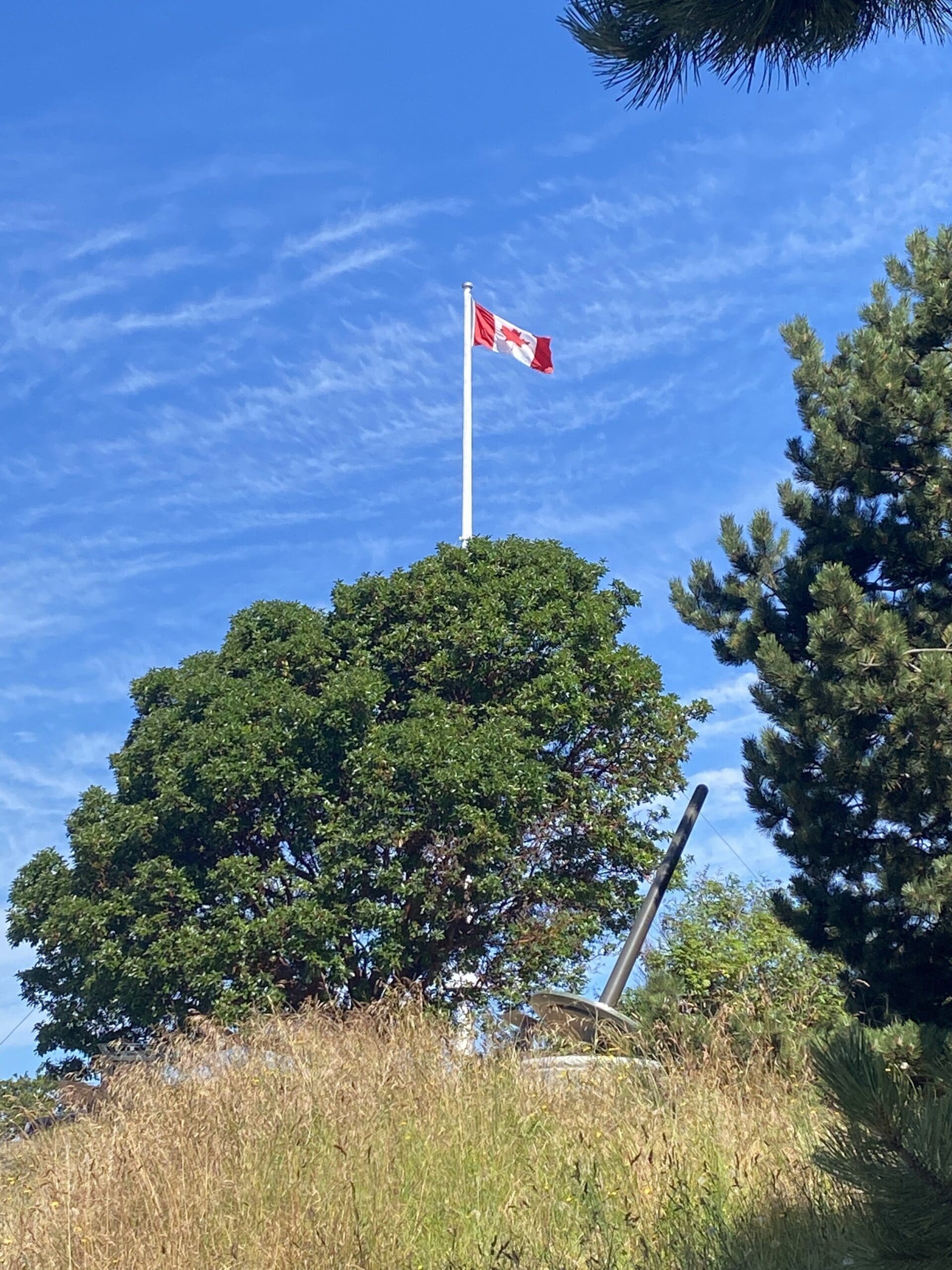 Canadian Flagpole and Signs of Lekwungen atop Beacon Hill