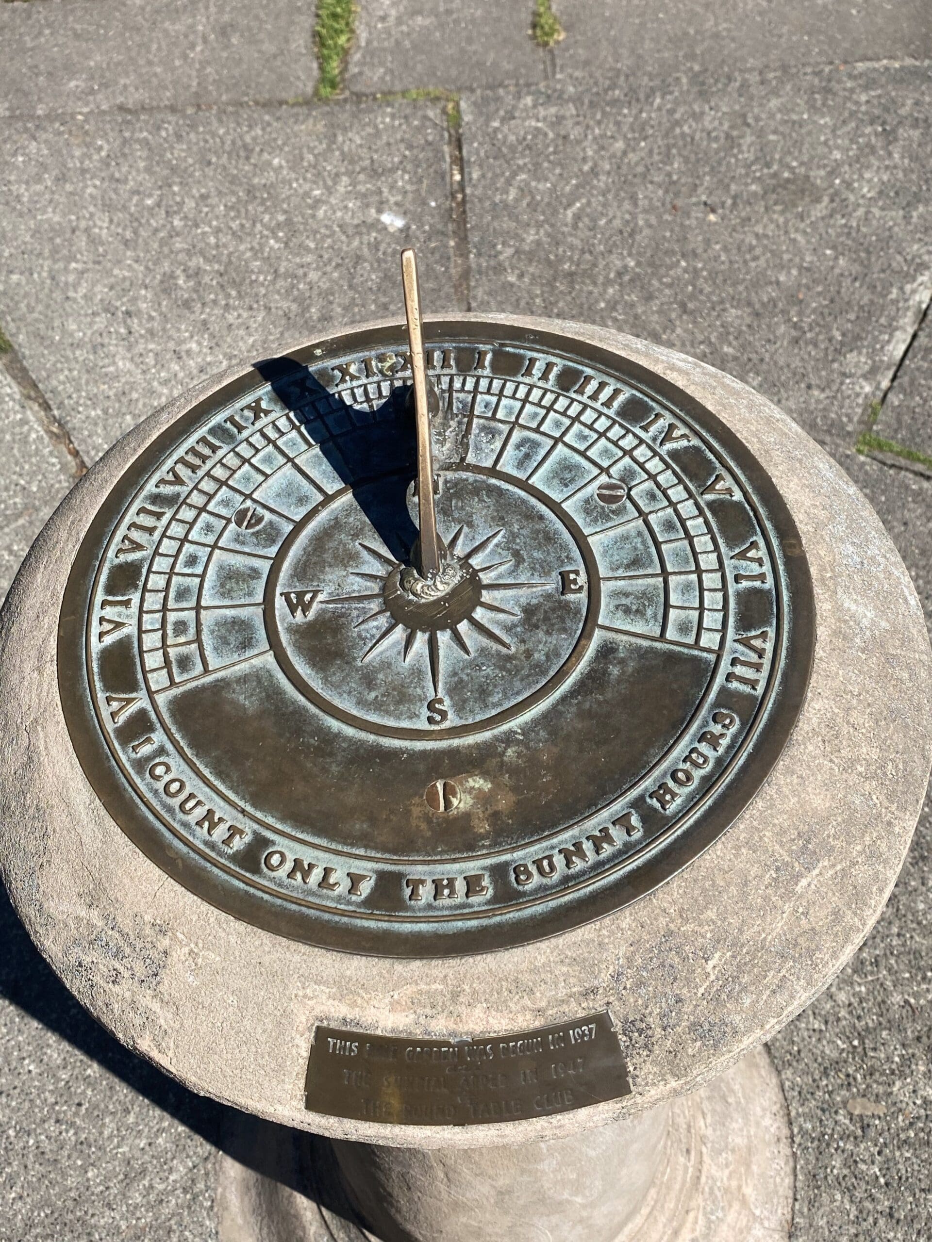 Close up of Sun Dial, located in the center of the east garden in Beacon Hill Park which reads "I count only the sunny hours"