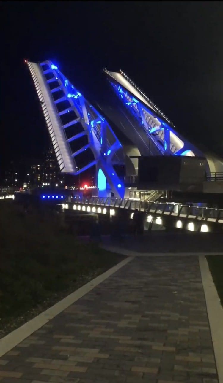 Johnson Street Bridge in lift mode at night.
