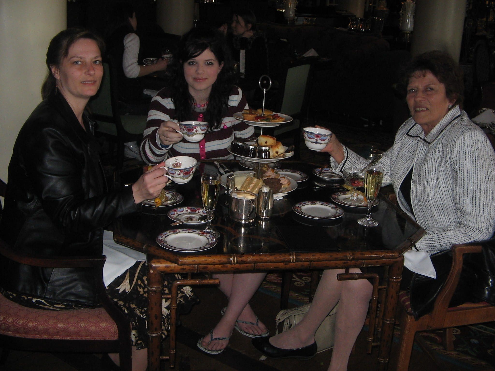 Gail, her daughter and her mother sitting at the Empress  enjoying High Tea in 2005.