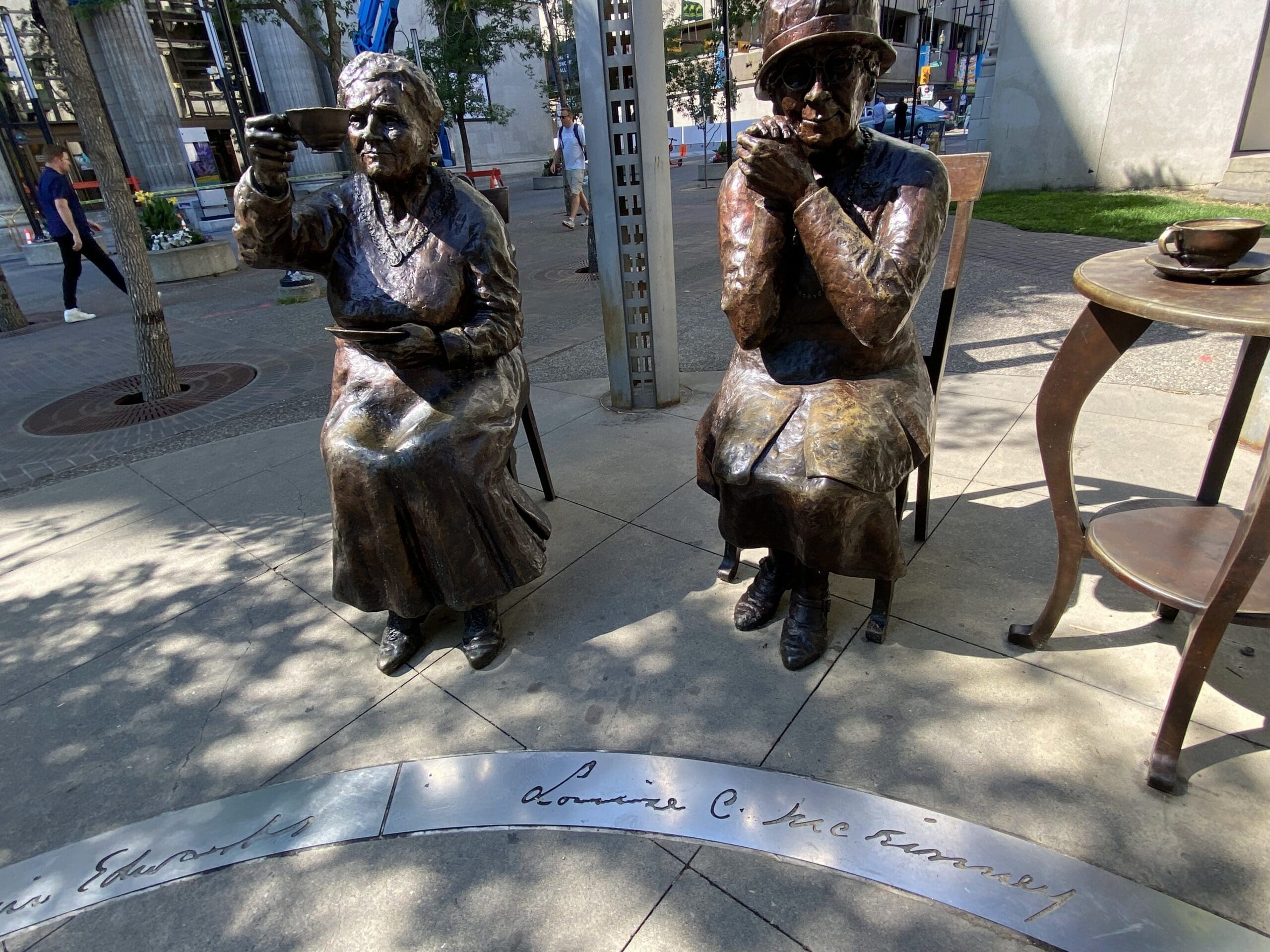 Two of the five women(statues), with their names written on the inner circle "Louise McKinney and Henrietta Muir Edwards".