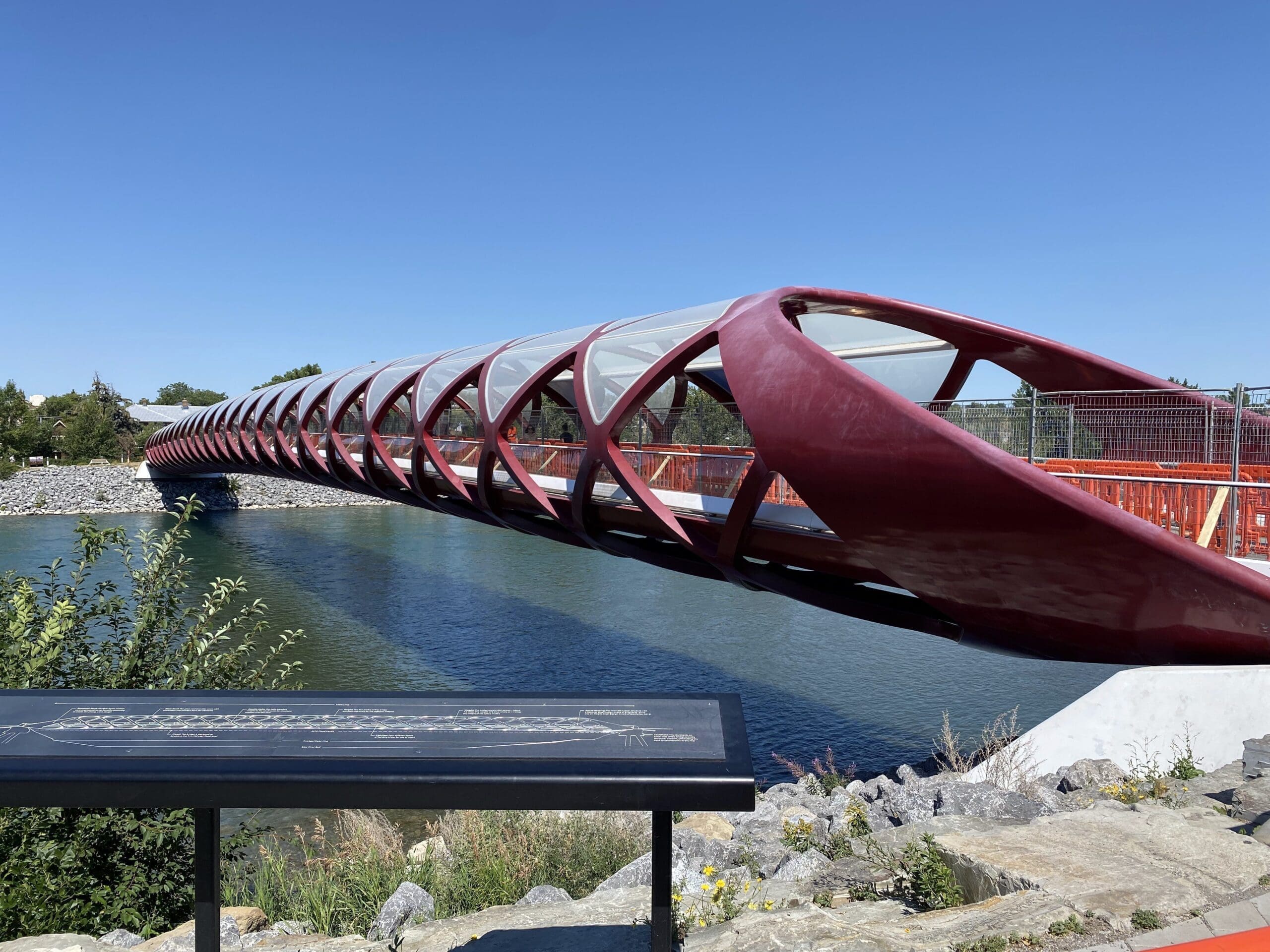 Peace bridge with signage showing details in front.