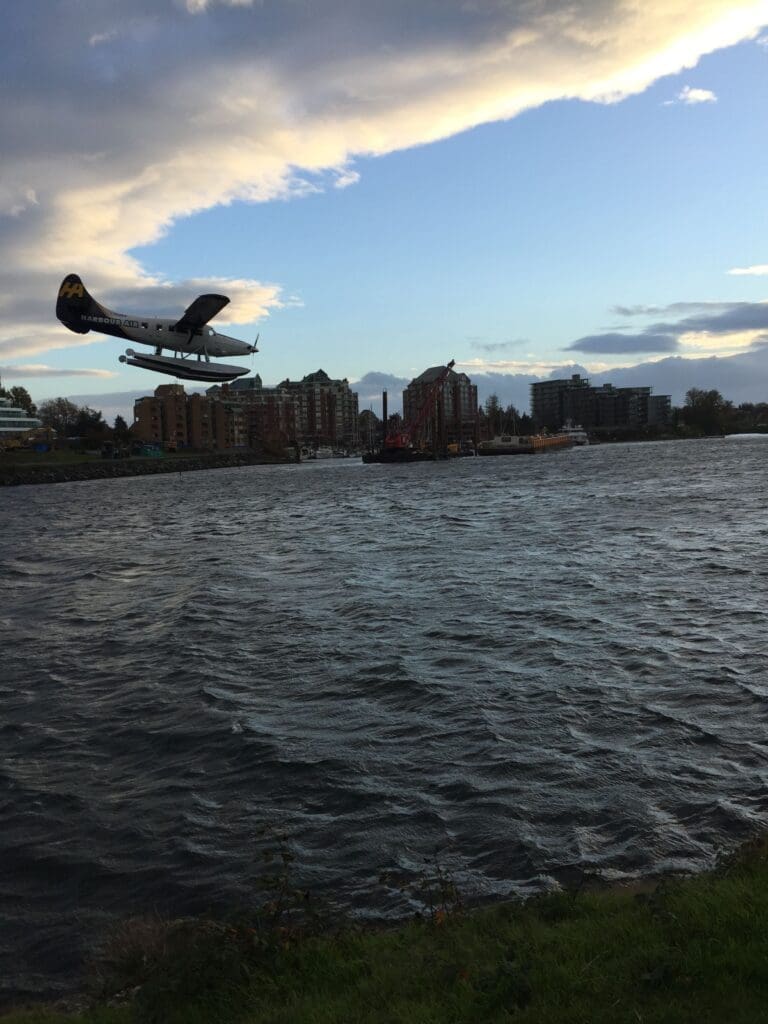 One of our favourite free things to do in Victoria is to watch the harbour float planes land and take off.  This one is landing on a very windy day, with the clouds seemingly chasing it.