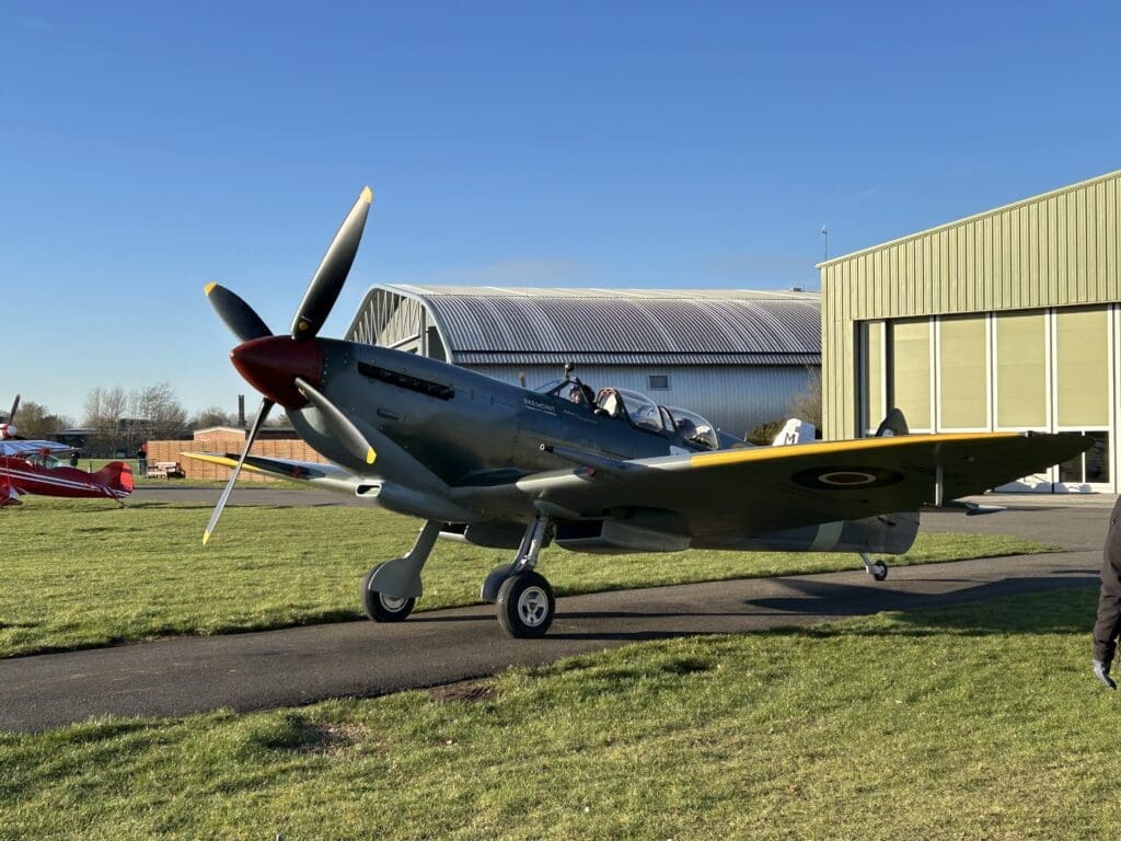 The spitfire at Duxford, one of the choices for vintage or warbird aircraft for a UK flying experience.