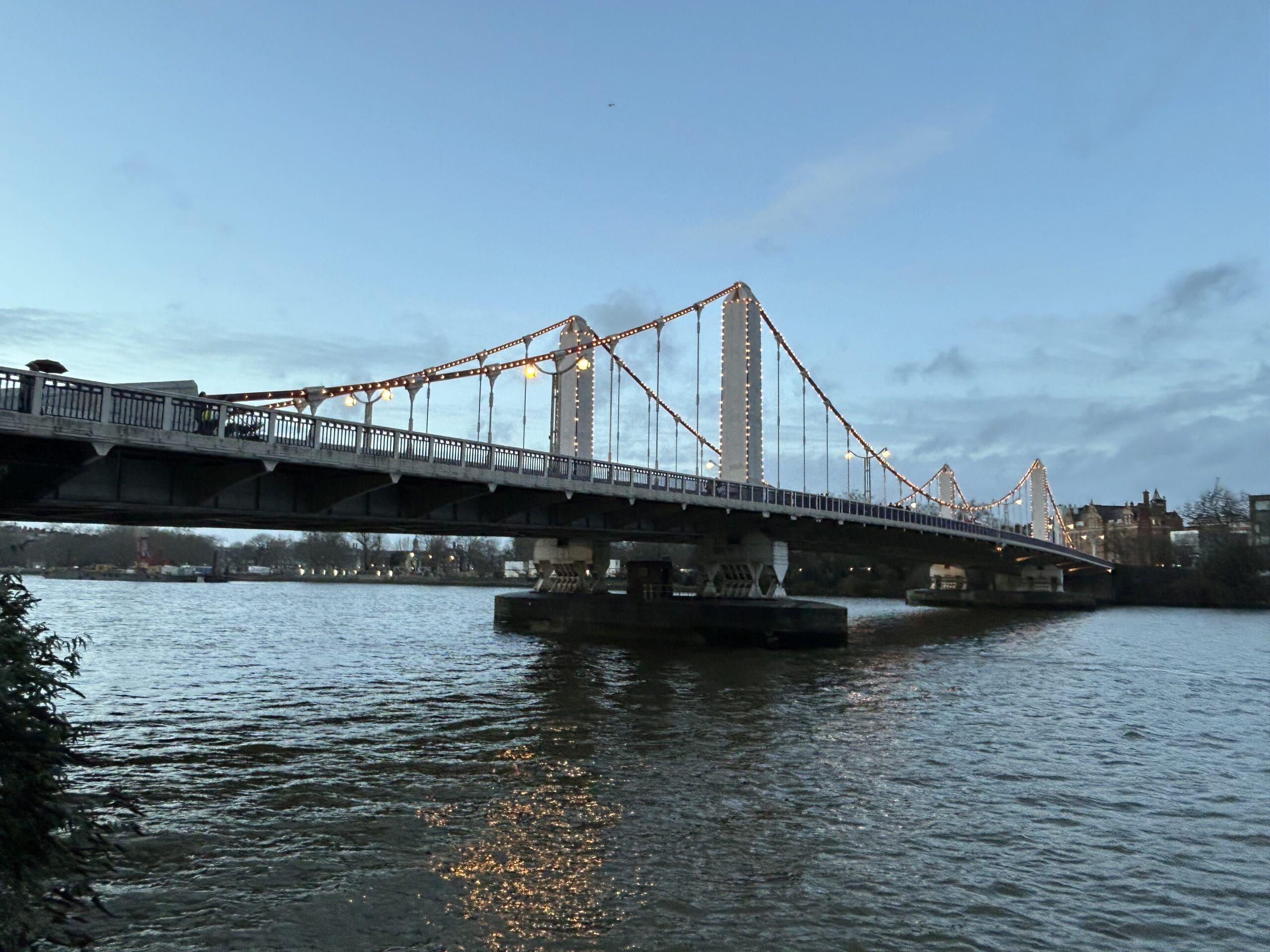 This is the Chelsea Bridge in London UK just as the illumination is beginning.